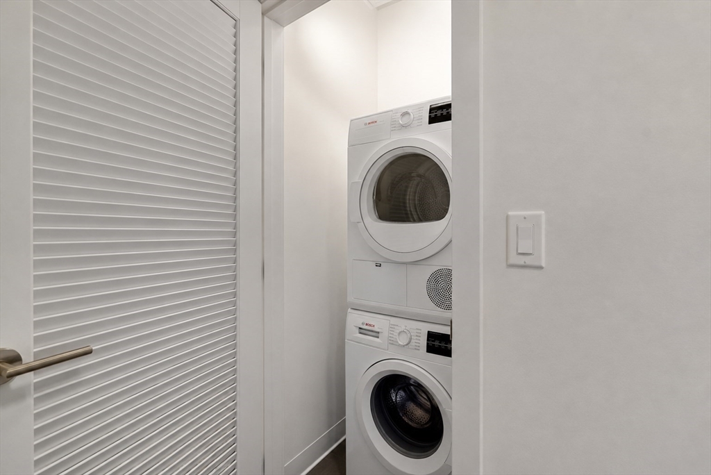 45 Lewis Street, Unit 312 Boston, MA 02128 - Photo 11 of 17 a view of a small space with washer and dryer