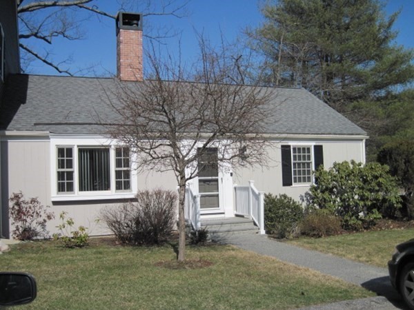 114 Jericho Road, Unit 114 Weston, MA 02493 - Photo 1 of 9 front view of a house with a yard