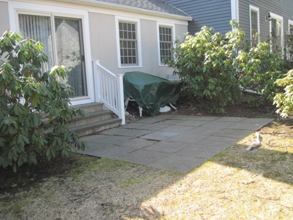 114 Jericho Road, Unit 114 Weston, MA 02493 - Photo 3 of 9 a view of a house with backyard