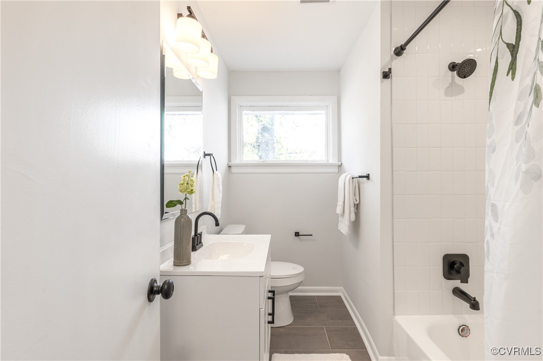 2106 Ridgemont Road Richmond, VA 23224 - Photo 23 of 32 Bathroom featuring toilet, baseboards, tile patter