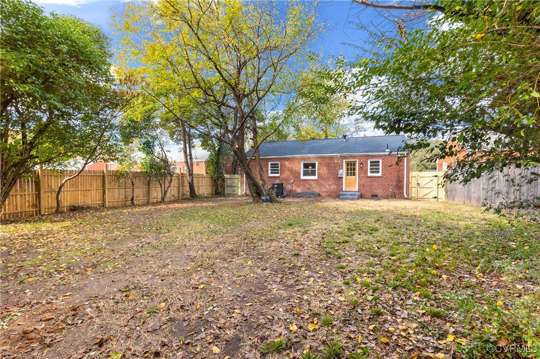 2106 Ridgemont Road Richmond, VA 23224 - Photo 31 of 32 View of yard with a gate, entry steps, and a fence