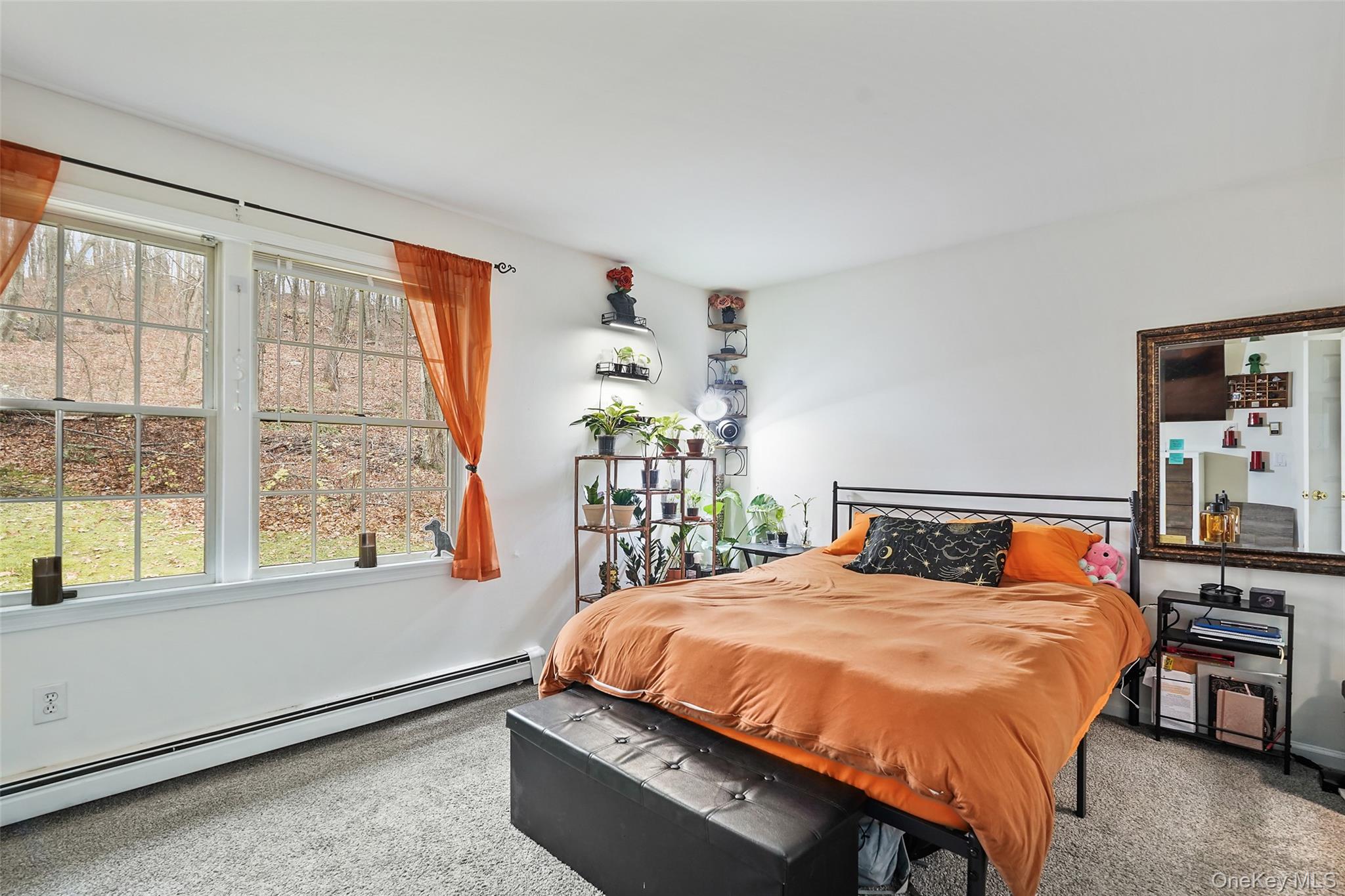 272 Van Wyck Lake Road Fishkill, NY 12524 - Photo 13 of 25 a bedroom with a large bed and a large window