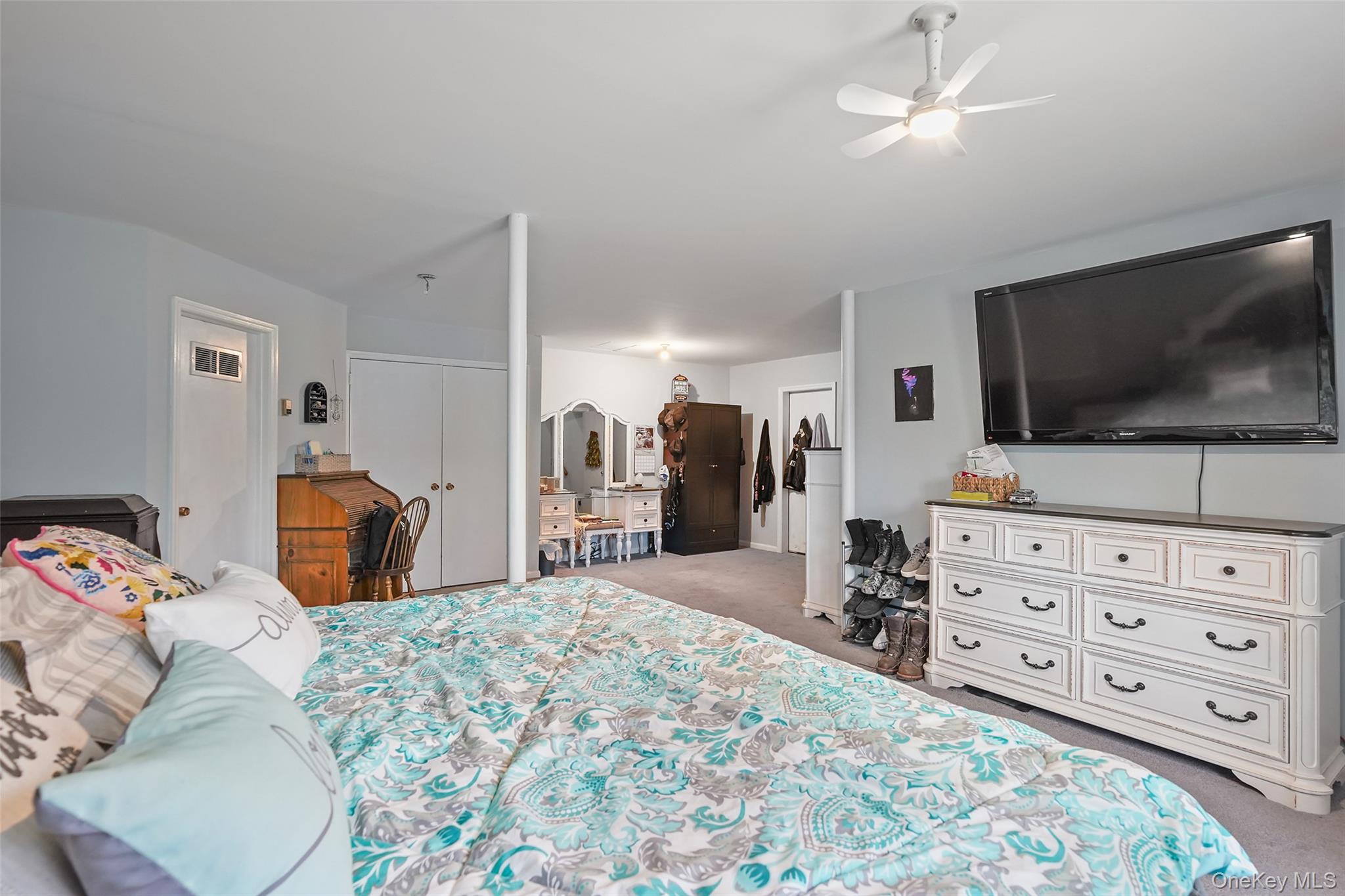 272 Van Wyck Lake Road Fishkill, NY 12524 - Photo 18 of 25 a bedroom with a bed and a flat screen tv