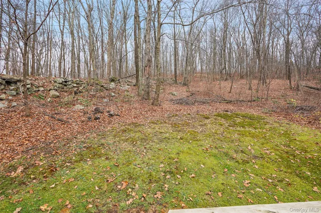a view of small space with wooden fence