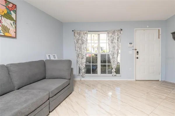 a living room with furniture and a window