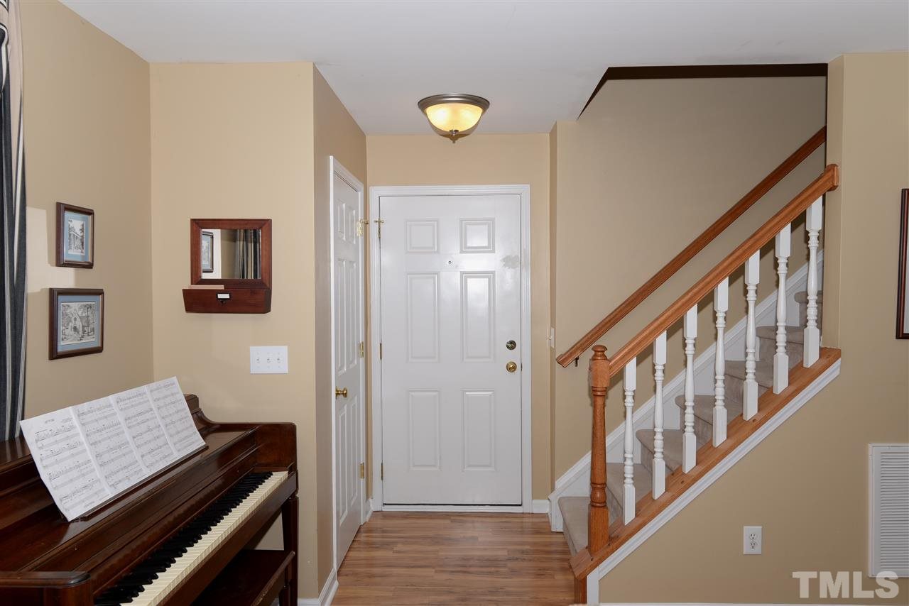 278 Inkster Cove Raleigh, NC 27603 - Photo 3 of 25 a view of an entryway with wooden floor