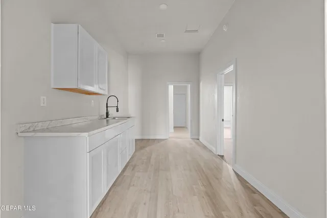 a bathroom with a sink a mirror and a bathtub