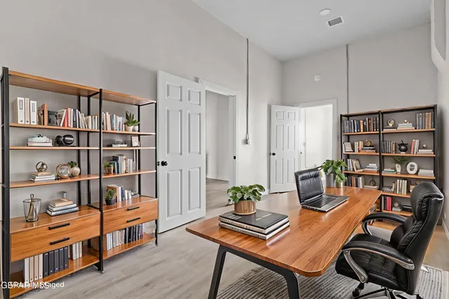 a workspace with furniture and book shelf