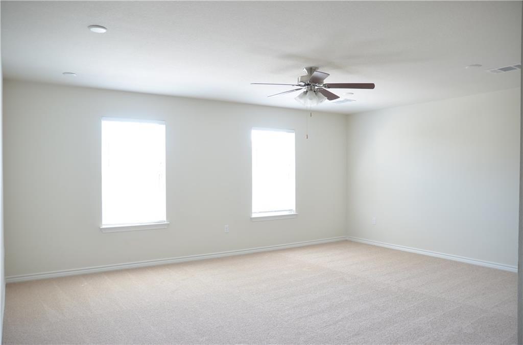 14403 McCoy Loop Austin, TX 78717 - Photo 16 of 29 A quiet retreat with gentle carpeting and a convenient ceiling fan, ready for your personal touch.