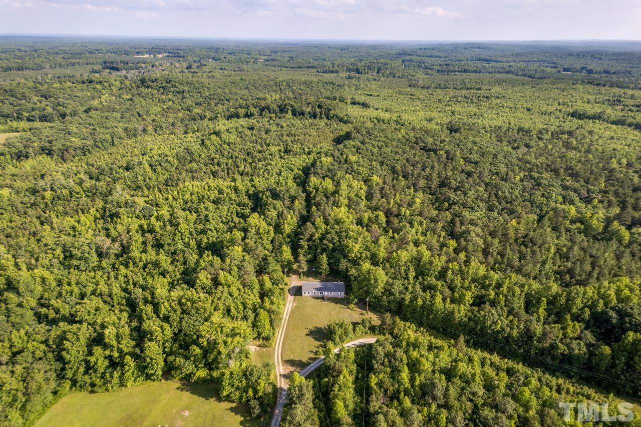 517 Circle B Farm Road Rougemont, NC 27572 - Photo 1 of 37 a view of a field with an trees