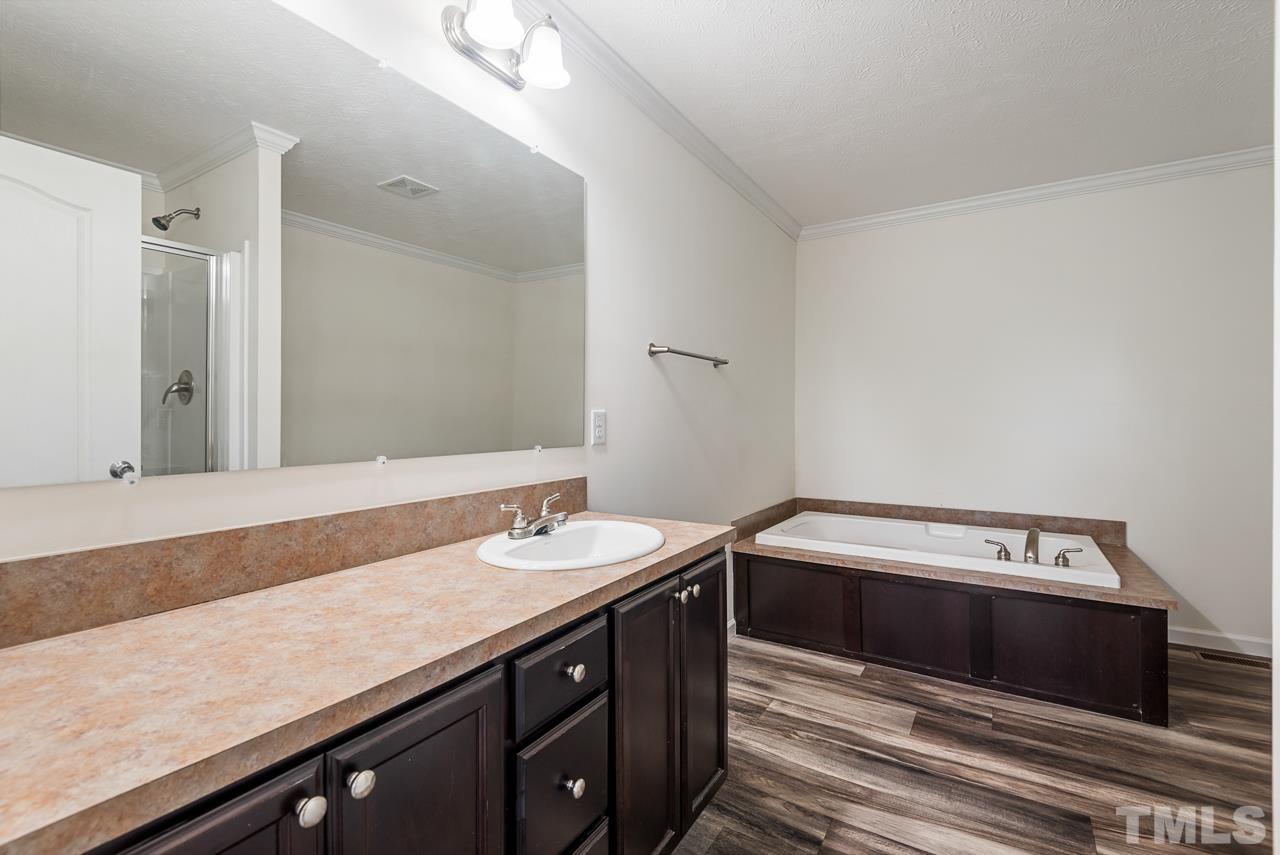 517 Circle B Farm Road Rougemont, NC 27572 - Photo 19 of 37 a bathroom with a sink and a mirror