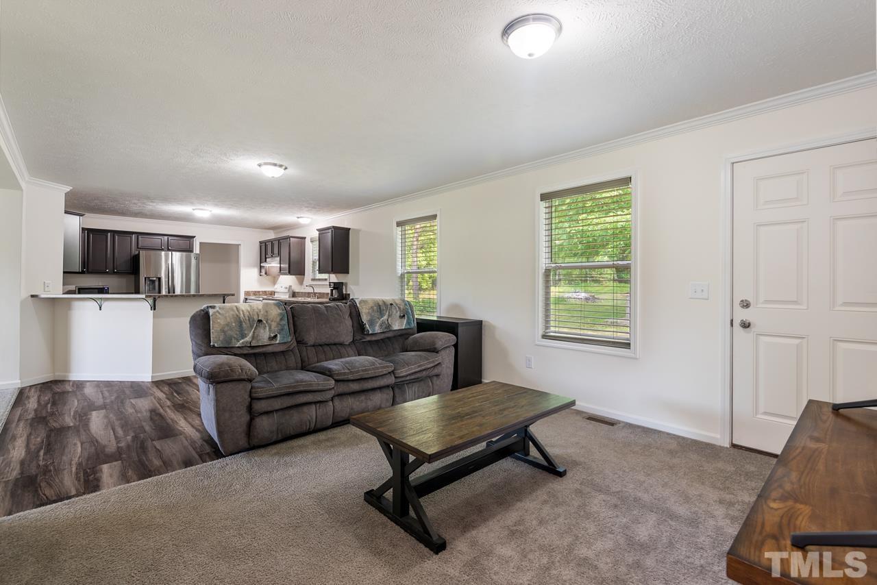 517 Circle B Farm Road Rougemont, NC 27572 - Photo 8 of 37 a living room with furniture and a window