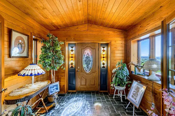 a view of an entryway with wooden floor