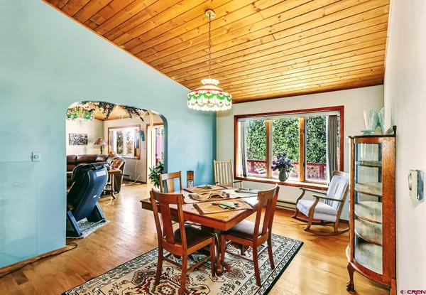 a dining room with furniture and window