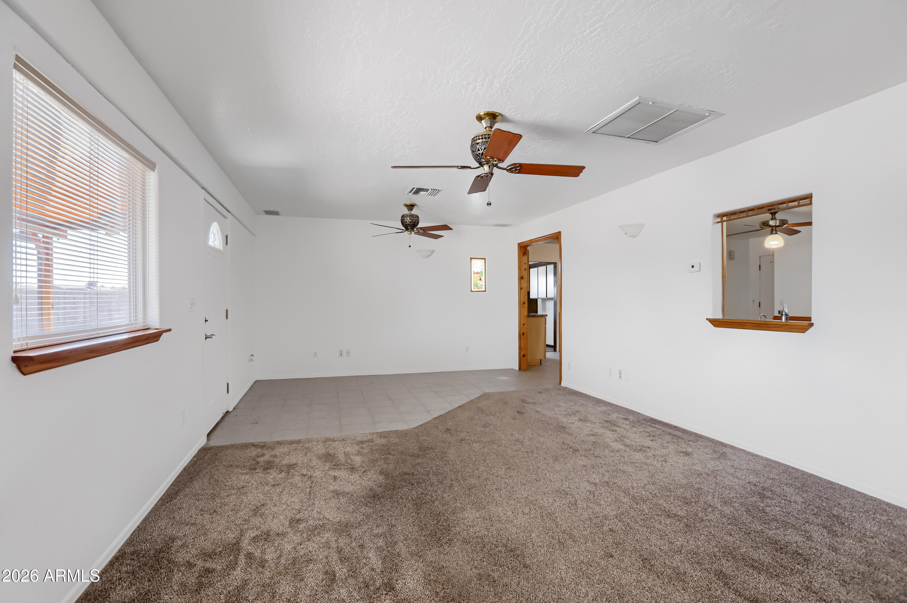 3823 West Greenway Road Phoenix, AZ 85053 - Photo 12 of 28 wooden floor in an empty room with a window