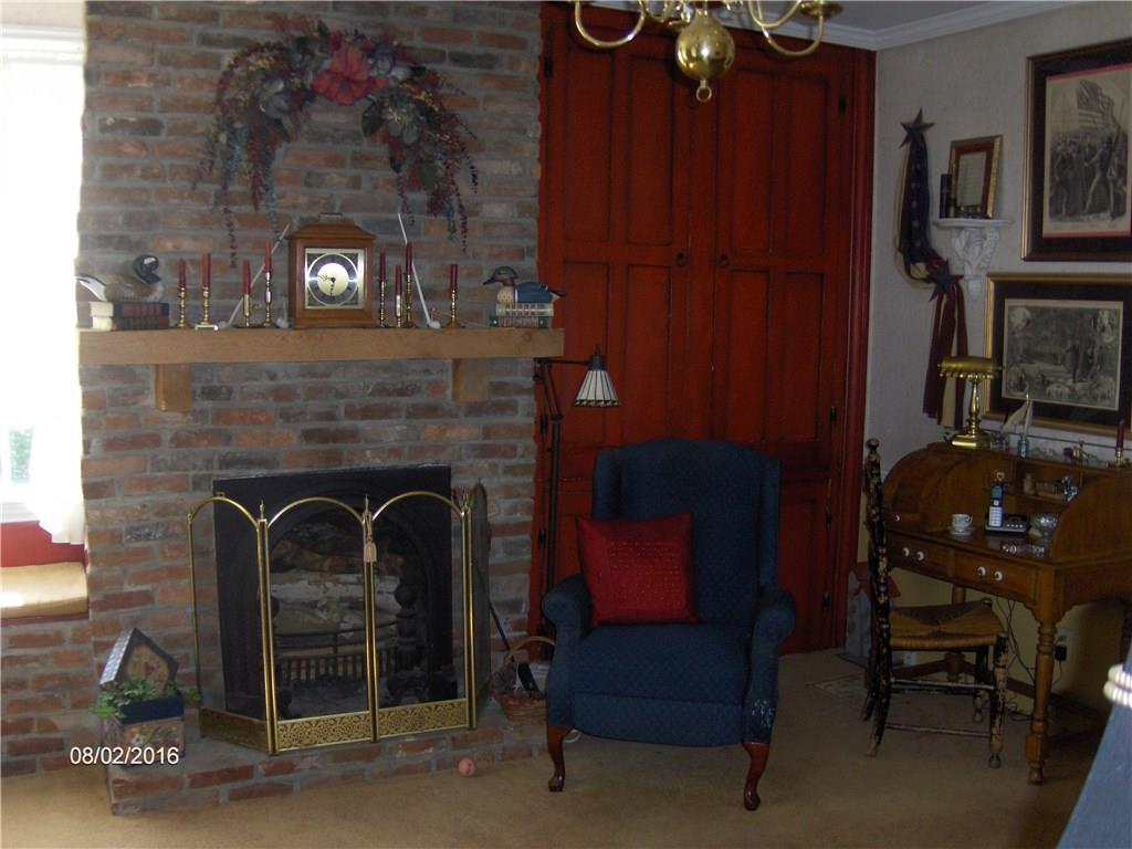 14 State Line Road Burgettstown, PA 15021 - Photo 8 of 18 Wood burning fireplace in the living room.