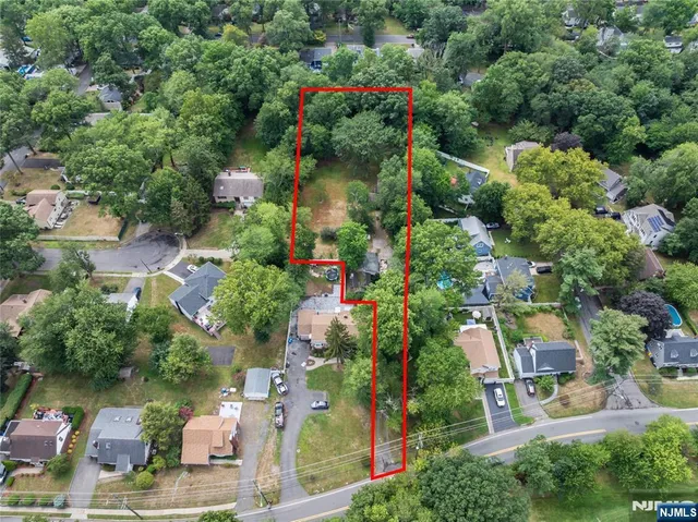 an aerial view of a houses with yard