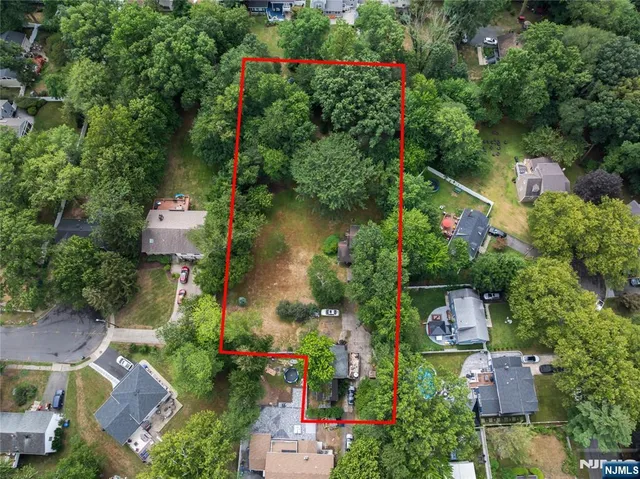 an aerial view of house with swimming pool outdoor seating and yard