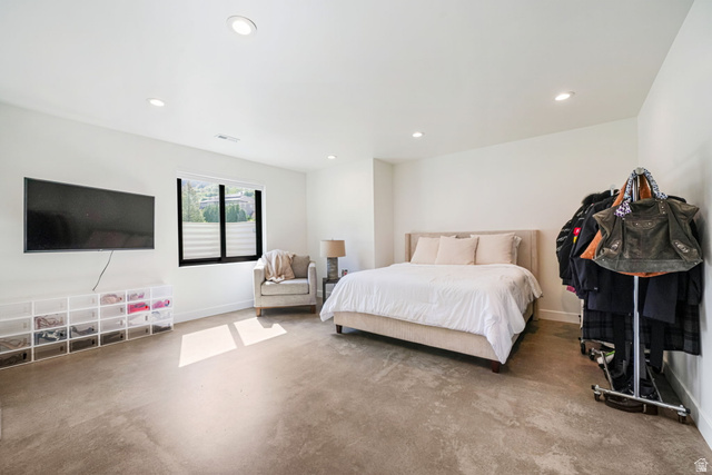 3667 Little Cottonwood Road, Unit 1 Sandy, UT 84092 - Photo 30 of 49 Spacious room featuring neutral walls, recessed lighting, a modern window with black trim, and light-toned carpet flooring