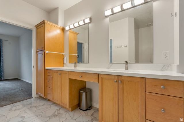 1092 Tithing Ridge Drive Riverton, UT 84065 - Photo 10 of 25 Bathroom featuring a dual vanity with light wood cabinetry, white stone countertops, and integrated sinks