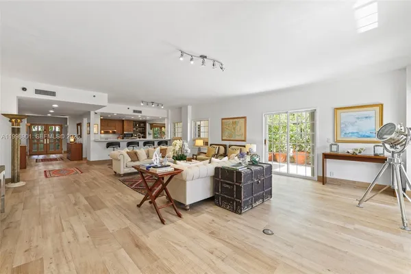 a bathroom with a double vanity sink mirror and bathtub