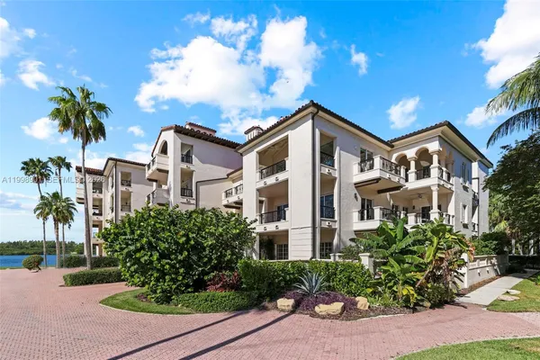 a picture of houses with outdoor space and lake view