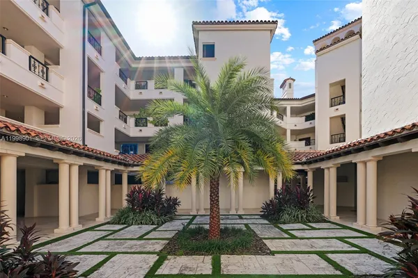 a kitchen with stainless steel appliances granite countertop a sink a stove top oven a counter space and cabinets
