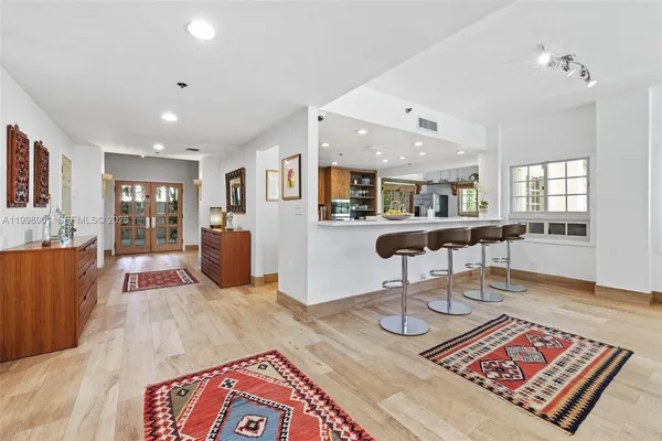 a kitchen with stainless steel appliances granite countertop a refrigerator and a sink