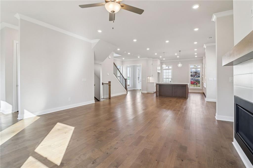 159 Basil Street Cumming, GA 30040 - Photo 12 of 70 a view of kitchen and hall with wooden floor