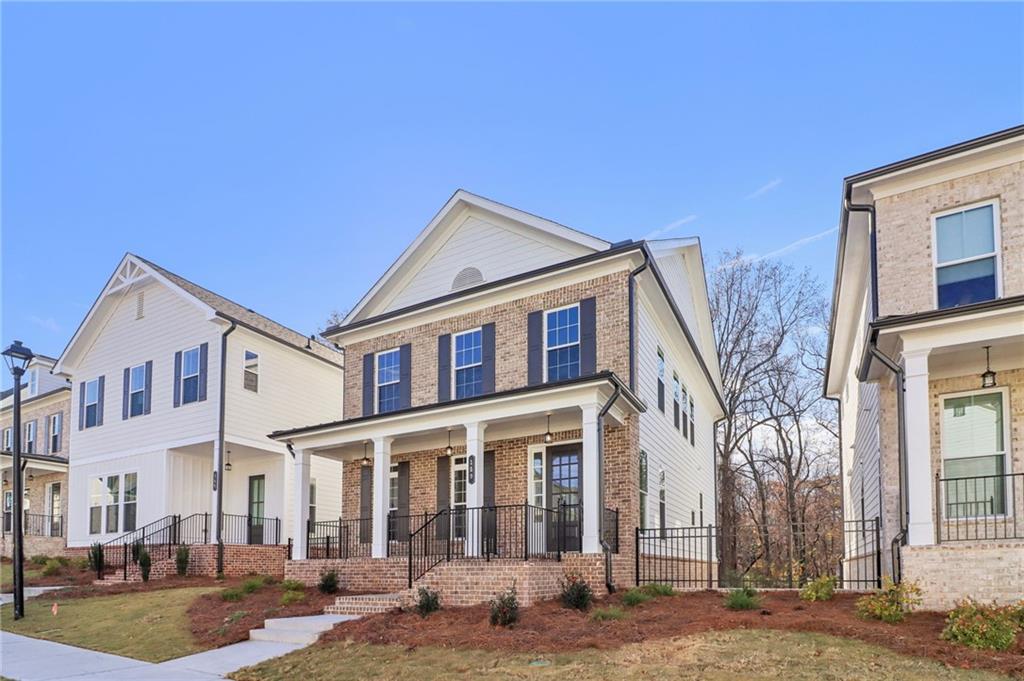 159 Basil Street Cumming, GA 30040 - Photo 2 of 70 a front view of a building with street view