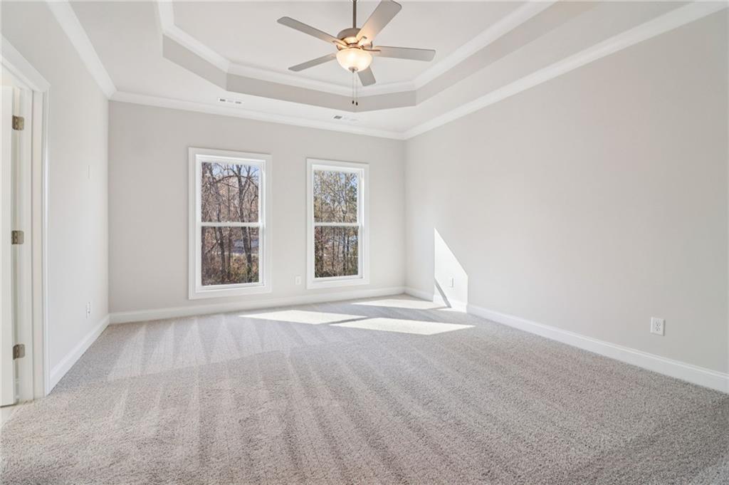 159 Basil Street Cumming, GA 30040 - Photo 21 of 70 an empty room with windows and fan