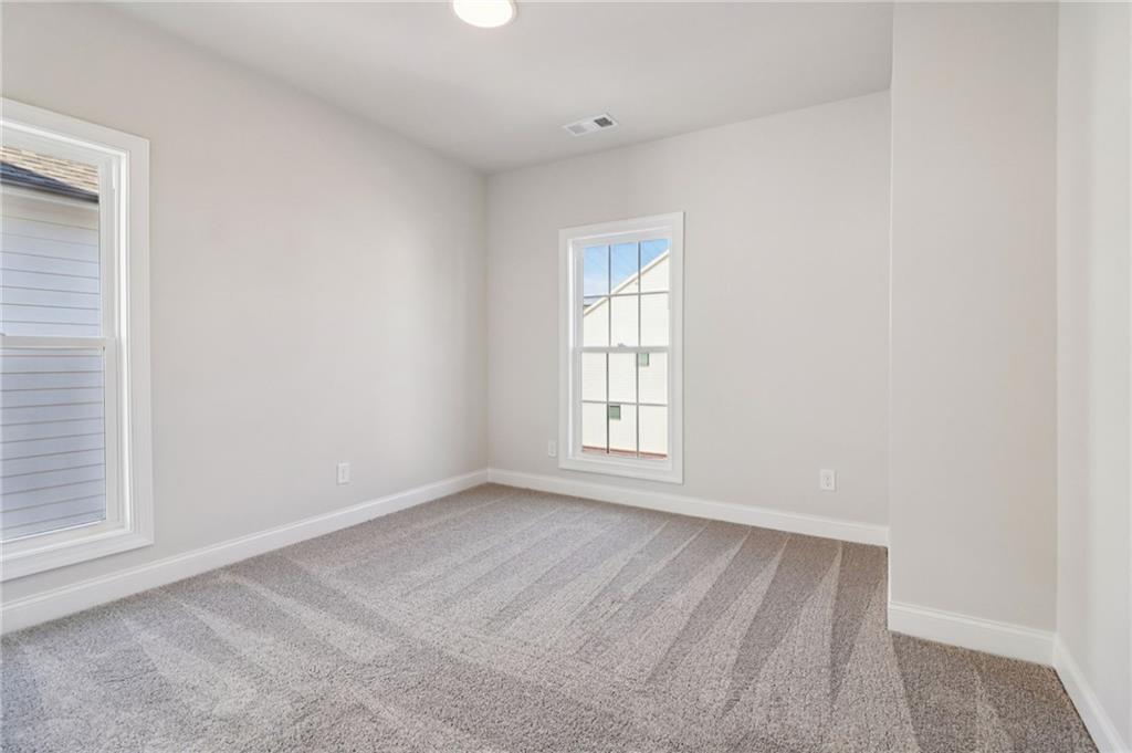 159 Basil Street Cumming, GA 30040 - Photo 29 of 70 an empty room with a window