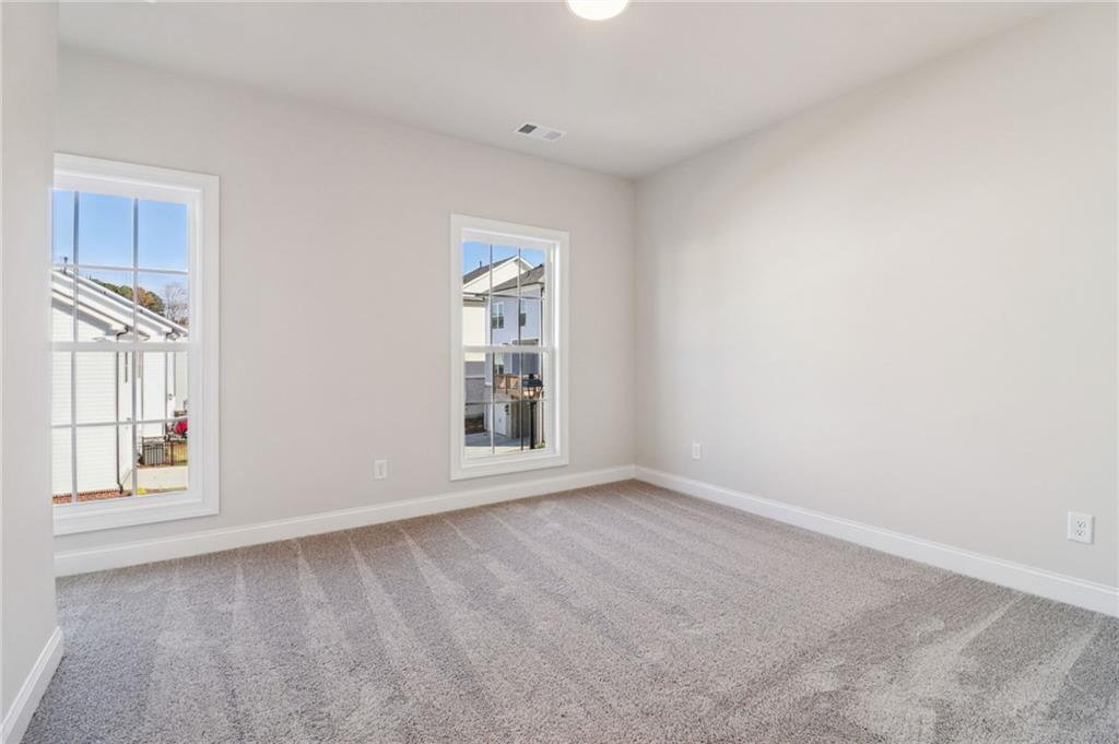 159 Basil Street Cumming, GA 30040 - Photo 33 of 70 an empty room with windows