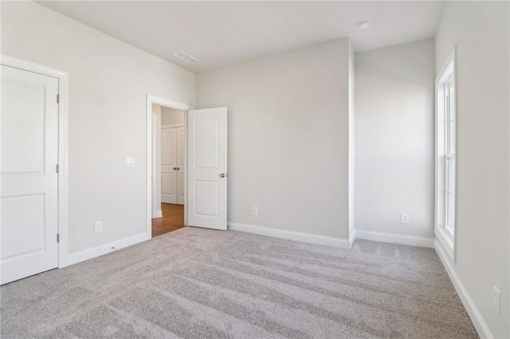 159 Basil Street Cumming, GA 30040 - Photo 35 of 70 a view of an empty room