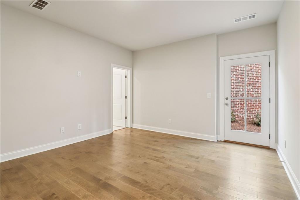 159 Basil Street Cumming, GA 30040 - Photo 40 of 70 an empty room with windows