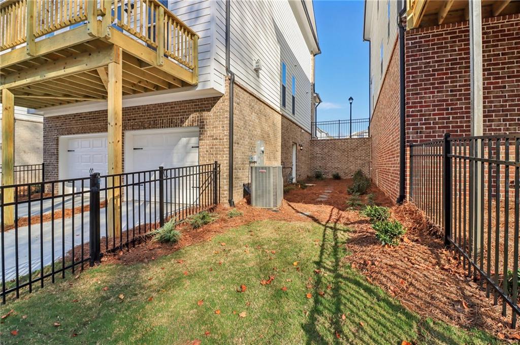 159 Basil Street Cumming, GA 30040 - Photo 49 of 70 a view of a house with backyard and sitting area