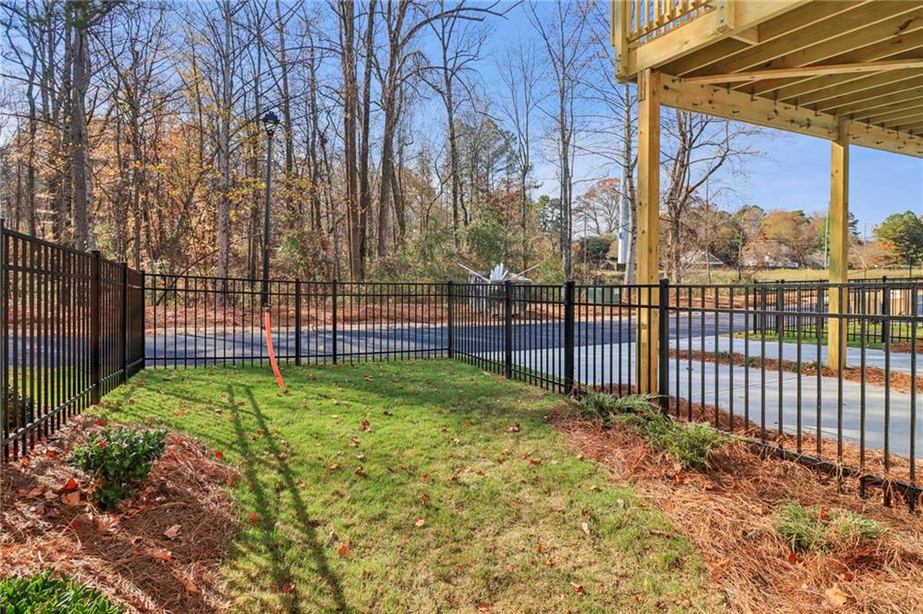 159 Basil Street Cumming, GA 30040 - Photo 51 of 70 a view of a backyard with a garden