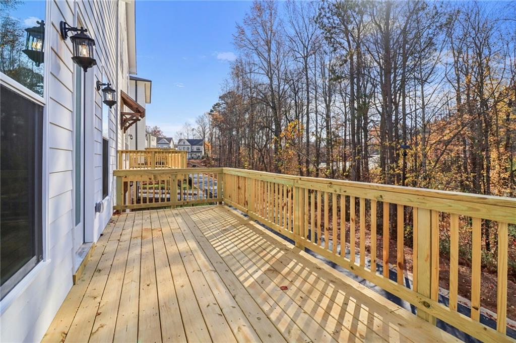 159 Basil Street Cumming, GA 30040 - Photo 52 of 70 a view of a balcony with wooden floor