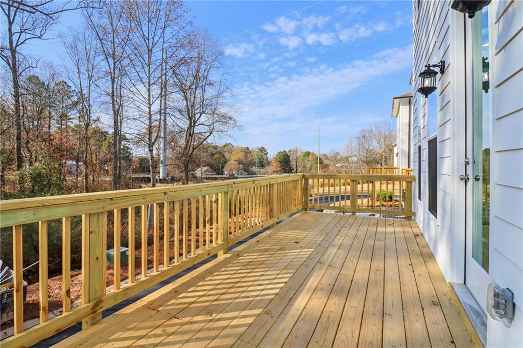159 Basil Street Cumming, GA 30040 - Photo 53 of 70 a view of wooden balcony with wooden floor and fence