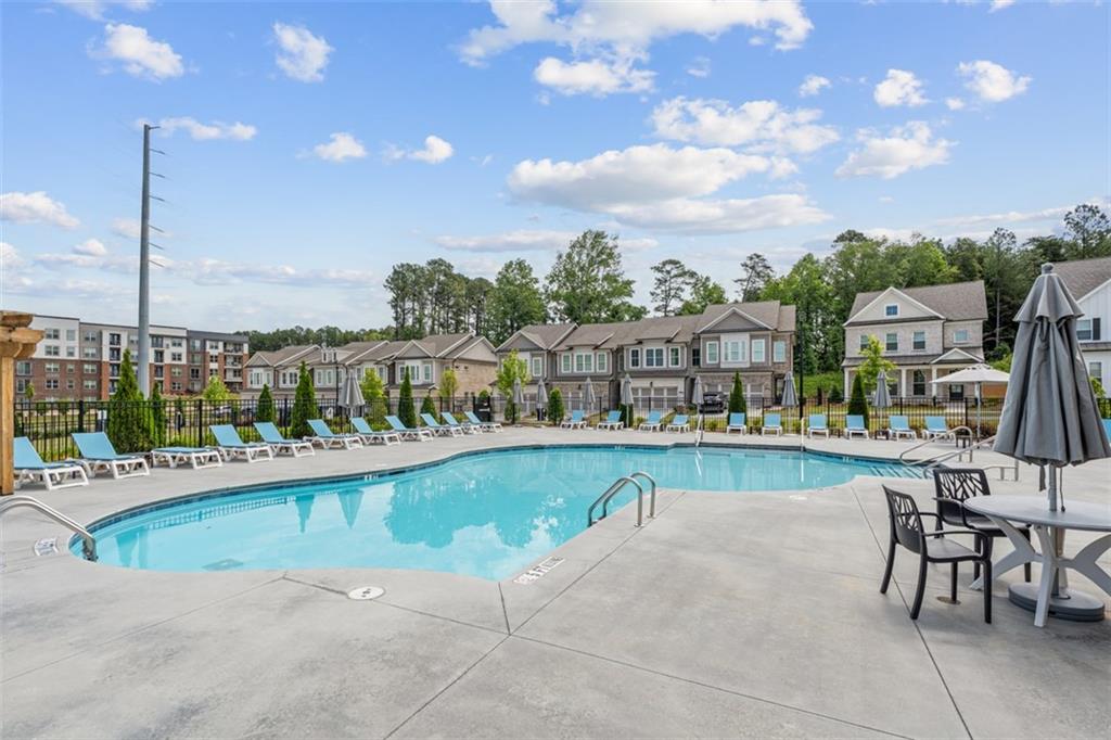 159 Basil Street Cumming, GA 30040 - Photo 57 of 70 a view of a swimming pool and a chairs