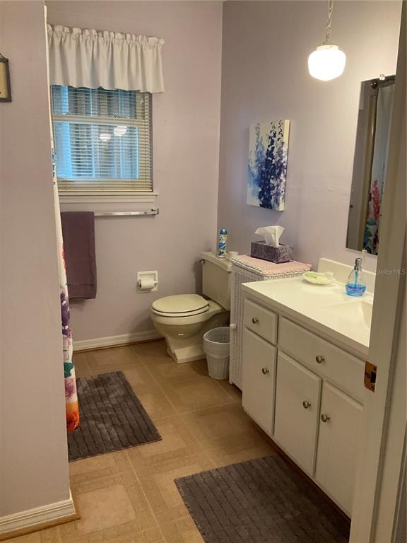 2438 Southeast 32nd Street Okeechobee, FL 34974 - Photo 20 of 42 a bathroom with a sink and a mirror
