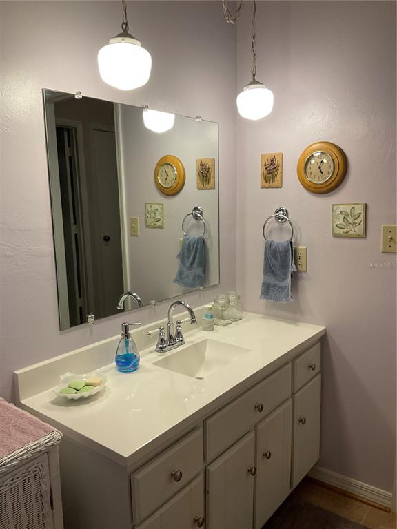 2438 Southeast 32nd Street Okeechobee, FL 34974 - Photo 21 of 42 a bathroom with a sink and a mirror