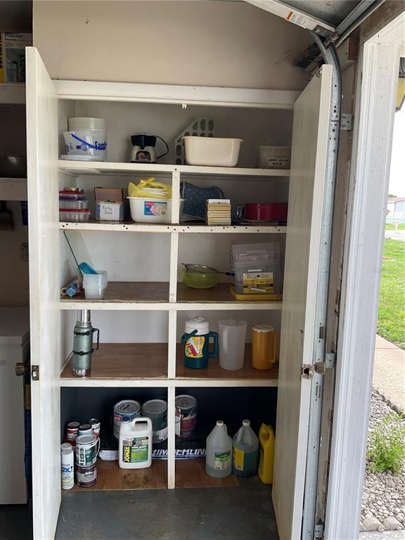 2438 Southeast 32nd Street Okeechobee, FL 34974 - Photo 24 of 42 a shelf with cup and plates