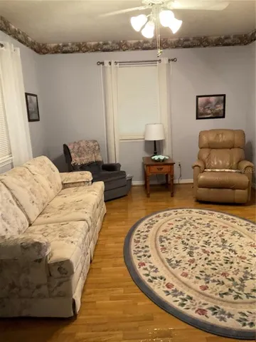 a living room with a bed and furniture