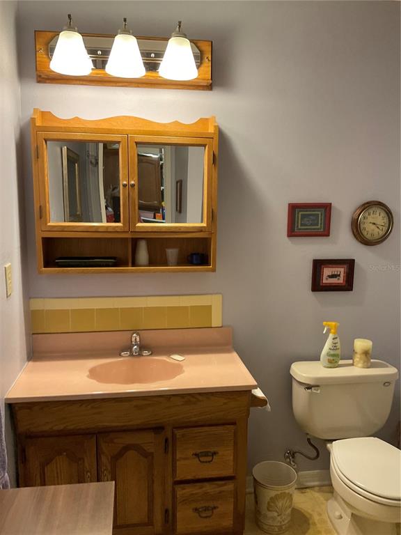 2438 Southeast 32nd Street Okeechobee, FL 34974 - Photo 29 of 42 a bathroom with a sink and a toilet