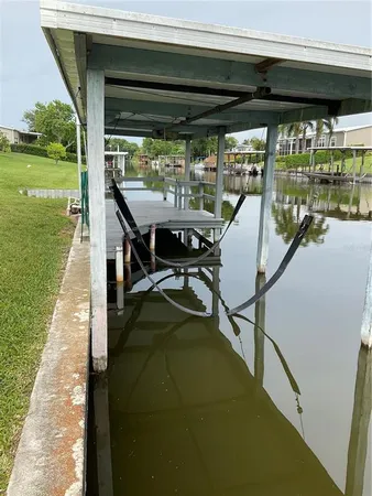 a view of swimming pool with a patio and a yard