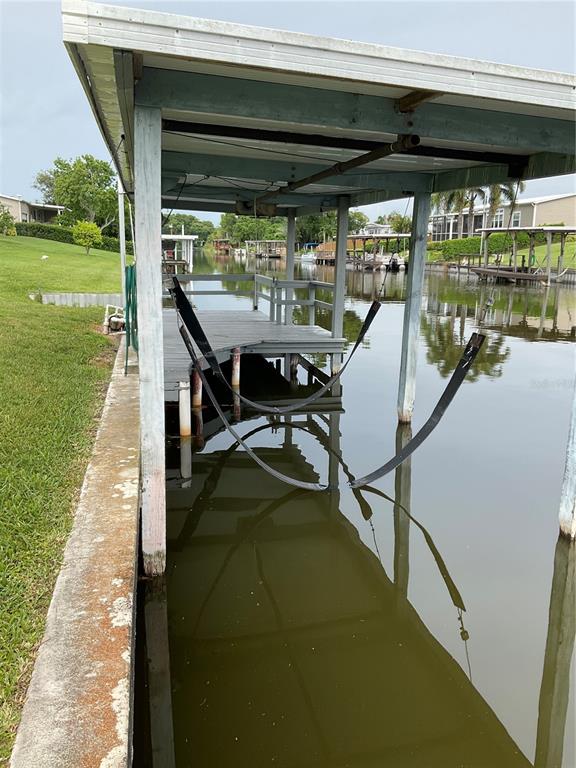 2438 Southeast 32nd Street Okeechobee, FL 34974 - Photo 32 of 42 a view of swimming pool with a patio and a yard