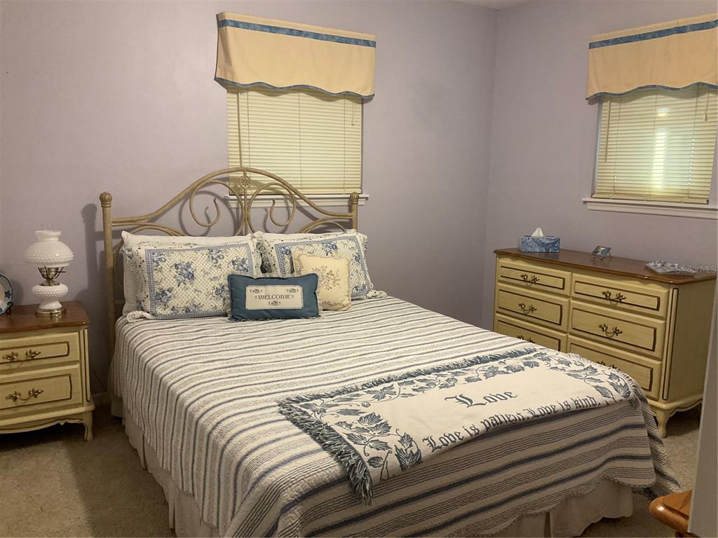 2438 Southeast 32nd Street Okeechobee, FL 34974 - Photo 7 of 42 a bedroom with a bed and a window