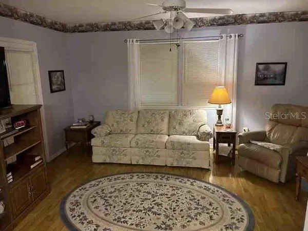 a living room with furniture and a rug