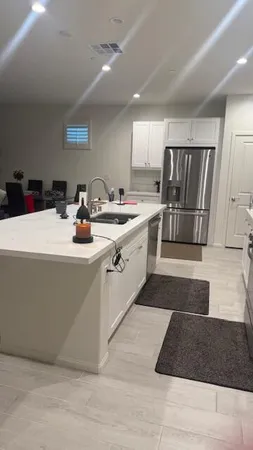 a bedroom with furniture and a flat screen tv